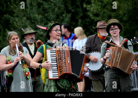 Littleborough, UK. 22nd July, 2018. Folk music players at the annual Rushbearing festival reviving the tradition of carrying the rushes to the local church dating back to a time when the church floors where earthen and the rushes were used to cover them for insulation. Littleborough,22nd July, 2018 (C)Barbara Cook/Alamy Live News Credit: Barbara Cook/Alamy Live News Stock Photo