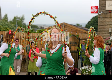 Littleborough, UK. 22nd July, 2018. Chelmsford Morris Green at the annual Rushbearing festival reviving the tradition of carrying the rushes to the local church dating back to a time when the church floors where earthen and the rushes were used to cover them for insulation. Littleborough,22nd July, 2018 (C)Barbara Cook/Alamy Live News Credit: Barbara Cook/Alamy Live News Stock Photo