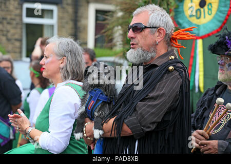 Littleborough, UK. 22nd July, 2018. A Dog looking at his handler at the annual Rushbearing festival reviving the tradition of carrying the rushes to the local church dating back to a time when the church floors where earthen and the rushes were used to cover them for insulation. Littleborough,22nd July, 2018 (C)Barbara Cook/Alamy Live News Credit: Barbara Cook/Alamy Live News Stock Photo