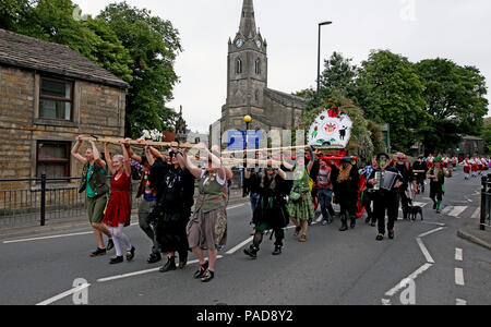 Littleborough, UK. 22nd July, 2018. The annual Rushbearing festival reviving the tradition of carrying the rushes to the local church dating back to a time when the church floors where earthen and the rushes were used to cover them for insulation. Littleborough,22nd July, 2018 (C)Barbara Cook/Alamy Live News Credit: Barbara Cook/Alamy Live News Stock Photo