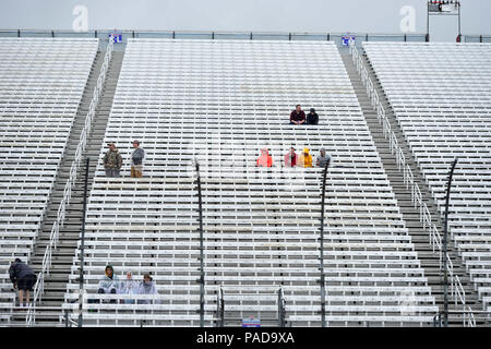 Loudon, New Hampshire, USA. 22nd July, 2018. Die hard fans sit in the rain at the NASCAR Monster Energy Foxwoods Resort Casino 301, held at the New Hampshire Motor Speedway in Loudon, New Hampshire. Eric Canha/CSM/Alamy Live News Stock Photo