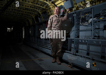 Sgt. Cassandra Peel, an avionic mechanic from Eureka, California, in Company B, 640th Aviation Support Battalion, 40th Combat Aviation Brigade, conducts phase maintenance on a UH-60 Black Hawk helicopter in Camp Buehring, Kuwait March 23. Peel is a self-taught artist who plans to attend college upon returning home. (U.S. Army Photo by Staff Sgt. Ian M. Kummer, 40th Combat Aviation Brigade Public Affairs) Stock Photo