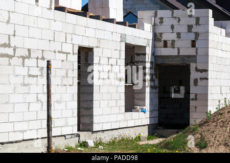 The first floor built of white gas silicate blocks of a house for people, a closeup of a building Stock Photo