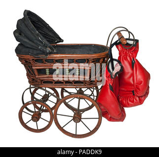 Vintage bassinet with Boxing Gloves showing Child Abuse - path included Stock Photo