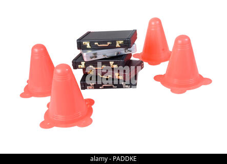 Leather briefcase surrounded by traffic cones - path included Stock Photo