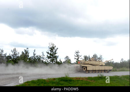 Members of a tank crew with the Tennessee Army National Guard’s H Troop, 2nd Squadron, 278th Armored Cavalry Regiment kick up dust as they race against the clock to their next land navigation point on an M1A1 Abrams tank while competing in the Gen. Gordon Sullivan Cup best tank crew competition at Fort Benning, Ga., Tuesday, May 3, 2016. The Sullivan Cup tests tank crews from throughout the Army on everything from gunnery to mounted land navigation, maintenance and combat casualty care in a variety of physically and mentally challenges setting to determine the Army’s best tank crew. (U.S. Army Stock Photo