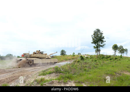 Members of a tank crew with the Tennessee Army National Guard’s H Troop, 2nd Squadron, 278th Armored Cavalry Regiment kick up dust as they race against the clock to their next land navigation point on an M1A1 Abrams tank while competing in the Gen. Gordon Sullivan Cup best tank crew competition at Fort Benning, Ga., Tuesday, May 3, 2016. The Sullivan Cup tests tank crews from throughout the Army on everything from gunnery to mounted land navigation, maintenance and combat casualty care in a variety of physically and mentally challenges setting to determine the Army’s best tank crew. (U.S. Army Stock Photo