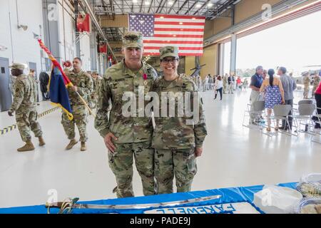 Col. Ronald W. Burkett II, outgoing commander, 36th CAB, and Col. Joanne MacGregor, incoming commander, 36th CAB, pose at a change of command ceremony, Austin, Texas, July 14, 2018. (Texas Army National Guard Photo by 2nd Lt. Caitlin Rourk) Stock Photo