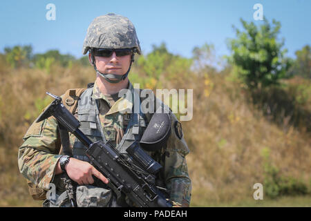 U.S. Army Sgt. Aidan Curran, center, with 1st Battalion, 114th Infantry ...