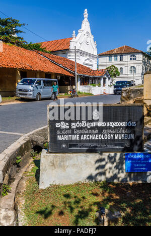 Sign at the entrance to the Maritime Archaeology Museum in Galle Fort, Galle, Southern Province, Sri Lanka, Dutch Reformed Church in the background Stock Photo