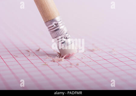 Pencil rubber erasing on a grid sheet Stock Photo