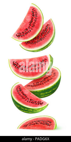 Isolated watermelon slices. Pieces of watermelon fruit flying in the air isolated on white background with clipping path Stock Photo