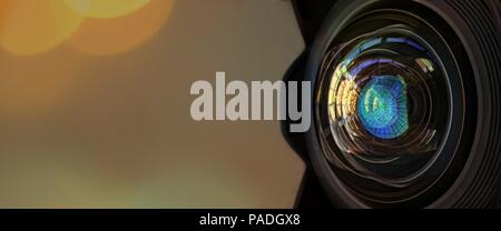Close up of a large camera lens with bokeh background and copy space . Stock Photo