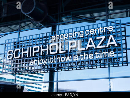 AMSTERDAM, NETHERLANDS - JULY 18, 2018: Schiphol Plaza Shopping center billboard with reflection Stock Photo