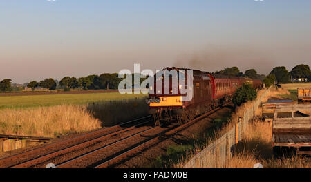 West Coast Railways diesel loco 37669 approaches Hoscar station early on the morning of 5.7.18 with the excursion train the “Scarborough Spa Express”. Stock Photo