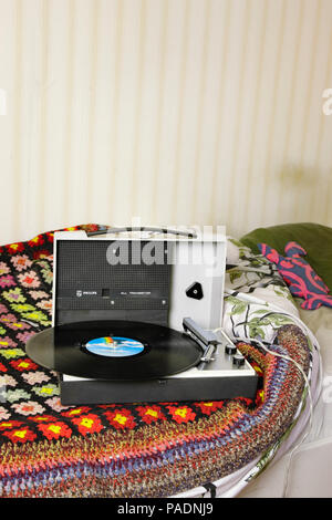record player with record in bedroom setting Stock Photo