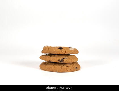 Three Stacked Chocolate Chip Cookies on White Background Stock Photo