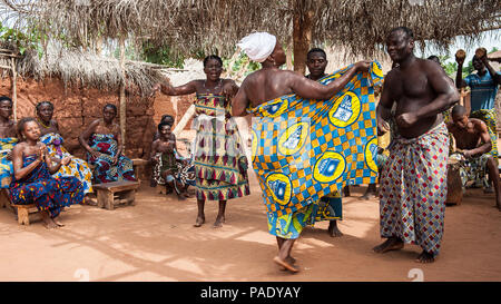 KARA, TOGO - MAR 11, 2012:  Unidentified Togolese people in traditional clothes dance the religious voodoo dance. Voodoo is the West African religion Stock Photo