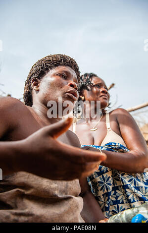 KARA, TOGO - MAR 11, 2012:  Unidentified Togolese woman dances the religious voodoo dance. Voodoo is the West African religion Stock Photo