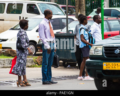 GABON - MARCH 6, 2013: Unidentified Gabonese people waiting for a bus on a bus stop in Gabon, Mar 6, 2013. People of Gabon suffer of poverty due to th Stock Photo