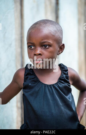 LIBREVILLE, GABON - MAR 6, 2013: Portrait of an Unidentified Gabonese beautiful little girl without hair in Gabon, Mar 6, 2013. People of Gabon suffer Stock Photo