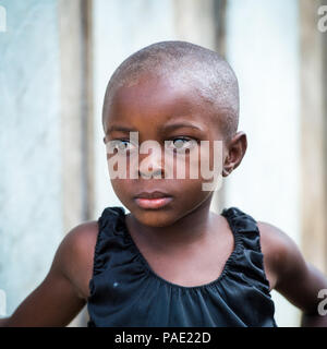 LIBREVILLE, GABON - MAR 6, 2013: Portrait of an Unidentified Gabonese beautiful little girl without hair in Gabon, Mar 6, 2013. People of Gabon suffer Stock Photo