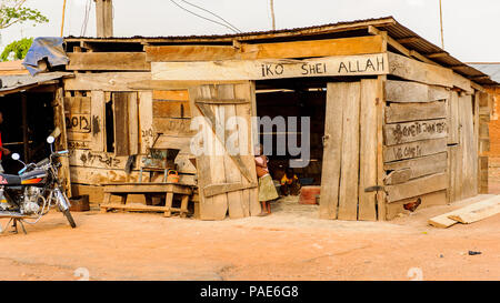 ACCRA, GHANA - MARCH 5, 2012: Unidentified Ghanaian people in the street in Ghana. People of Ghana suffer of poverty due to the unstable economic situ Stock Photo