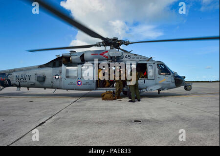 KEY WEST, Fla. (Sept. 12, 2017) Marines assigned to the 26th Marine Expeditionary Unit (MEU) disembark an SH-60S Sea Hawk attached to Helicopter Sea Combat Squadron (HSC) 28 during humanitarian assistance efforts. The Department of Defense is supporting Federal Emergency Management Agency, the lead federal agency, in helping those affected by Hurricane Irma to minimize suffering and as one component of the overall whole-of-government response effort. Stock Photo