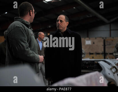 Staff Sgt. Travis Banks, 86th Materiel Maintainance Squadron armament systems technician, talks to Lt. Gen. Lee K. Levy II, Air Force Sustainment Center commander, about the capabilities the Central Regional Storage Facility site offers March 3, 2016, at Sanem, Luxembourg. The 86th MMS has the capability to store and maintain 500,000 square feet of equipment to be deployed at any given moment. (U.S. Air Force photo/Airman 1st Class Larissa Greatwood) Stock Photo