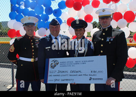 (From left to right) Staff Sgt. Joseph Colby, Retired Air Force Col. Mark Hustedt, Cadet Col. Jasmin Grewal, and Capt. Jeffrey Newman pose for a photo after Jasmin received the U.S. Marine Corps Naval Reserve Officers Training Corps (NROTC) scholarship during a presentation at Royal High School in Simi Valley, Calif., March 24, 2016. Grewal won the scholarship based on her commitment in and out of the classroom, to the community, leadership abilities, and physical fitness, and plans to attend Yale University. (U.S. Marine Corps photo by Staff Sgt. Alicia R. Leaders/Released) Stock Photo