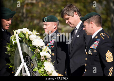 Commanding General of 1st Special Forces Command (Airborne)(Provisional) Maj. Gen. James E. Kraft Jr., President John F. Kennedy’s nephew Dr. William Kennedy Smith and 1st Special Forces Command (Airborne)(Provisional) Command Sgt. Maj. Brian C. Rarey lay a wreath at the gravesite of President John F. Kennedy in Arlington National Cemetery, Oct. 20, 2015, in Arlington, Va. Kennedy contributed greatly to the Special Forces, including authorizing the “Green Beret” as the official headgear for all U.S. Army Special Forces. Stock Photo
