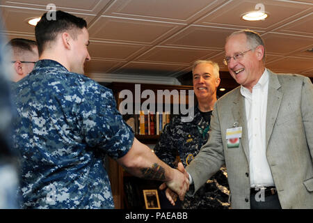 NEWPORT NEWS, Va. (Mar. 25, 2016) --  Rep. Mike Conaway of Texas meets Pre-Commissioning Unit Gerald R. Ford (CVN 78) Sailors who are Texas natives during a tour on the ship. Ford is currently under construction at Huntington Ingalls Newport News Shipbuilding. (U.S. Navy photo by Mass Communication Specialist Seaman Cathrine Mae O. Campbell/Released) (This image was altered for security purpose by blurring out security badges) Stock Photo