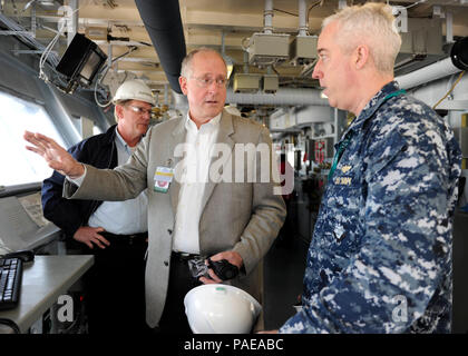 NEWPORT NEWS, Va. (Mar. 25, 2016) --  Rep. Mike Conaway of Texas tours Pre-Commissioning Unit Gerald R. Ford's (CVN 78) bridge with Capt. John F. Meier, the commanding officer of the ship. Ford is currently under construction at Huntington Ingalls Newport News Shipbuilding. (U.S. Navy photo by Mass Communication Specialist Seaman Cathrine Mae O. Campbell/Released) (This image was altered for security purpose by blurring out security badges) Stock Photo