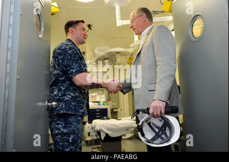 NEWPORT NEWS, Va. (Mar. 25, 2016) --  Rep. Mike Conaway of Texas meets one of his constituents, Hospital Corpsman 2nd class Kalvin Dobbs, a Ranger, Texas native, during a tour of the medical department on Pre-Commissioning Unit Gerald R. Ford (CVN 78). Ford is currently under construction at Huntington Ingalls Newport News Shipbuilding. (U.S. Navy photo by Mass Communication Specialist Seaman Cathrine Mae O. Campbell/Released) Stock Photo