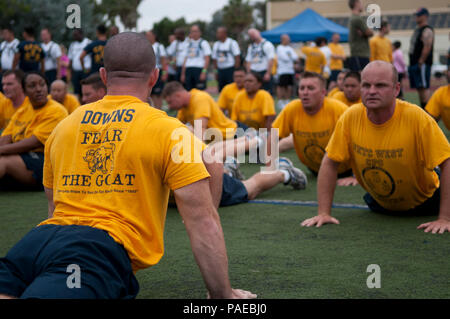 Chief petty officer selectees stretch prior to participating in the 26th annual POW/MIA 5K Run/Walk at Naval Base San Diego. The event saw an estimated 3,000 participants compete in remembrance of prisoners of war and service members missing in action. Stock Photo