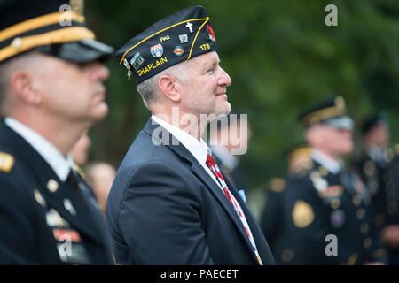 U.S. Army Chaplains and family members attend a ceremony at Chaplain's Hill in honor of the 242nd U.S. Army Chaplain Corps Anniversary at Arlington National Cemetery, Arlington, Va., July 28, 2017.  A wreath was also laid at the Tomb of the Unknown Soldier by Chaplain (Maj. Gen.) Paul K. Hurley, chief of chaplains, U.S. Army Chaplain Corps, and Sgt. Maj. Ralph Martinez, regimental sergeant major, U.S. Army Chaplain Corps. Stock Photo