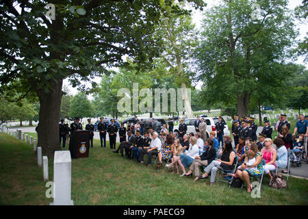 U.S. Army Chaplains and family members attend a ceremony at Chaplain's Hill in honor of the 242nd U.S. Army Chaplain Corps Anniversary at Arlington National Cemetery, Arlington, Va., July 28, 2017.  A wreath was also laid at the Tomb of the Unknown Soldier by Chaplain (Maj. Gen.) Paul K. Hurley, chief of chaplains, U.S. Army Chaplain Corps, and Sgt. Maj. Ralph Martinez, regimental sergeant major, U.S. Army Chaplain Corps. Stock Photo