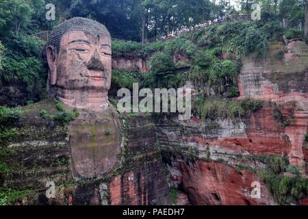 Leshan Giant Buddha 71 meters tall stone statue carved out of the cliff, faces confluence of Min River and Dadu River. Stock Photo