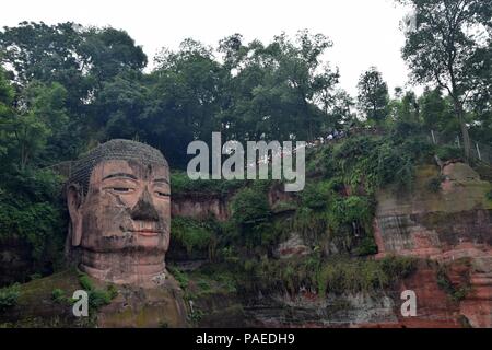 Leshan Giant Buddha 71 meters tall stone statue carved out of the cliff, faces confluence of Min River and Dadu River. Stock Photo