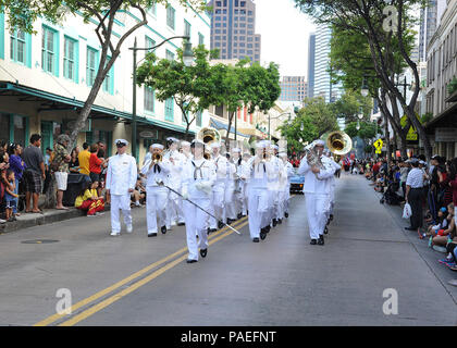 Members of the U.S. Navy Pacific Fleet Band march in downtown Chinatown during the 2014 Night in Chinatown Street Festival. The multi-block street festival in the heart of Chinatown featured live entertainment, foods and crafts. The Chinatown Merchants Association hosted the parade, which is held annually to celebrate the Chinese New Year. Stock Photo