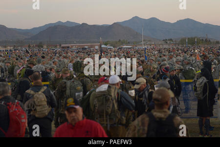 Participants of the Bataan Memorial Death March wait for the start of the event at White Sands Missile Range, New Mexico, March 20, 2016. The Bataan Memorial Death March honors a special group of World War II heroes. These service members were responsible for the defense of the islands of Luzon, Corregidor and the harbor defense forts of the Philippines. On April 9, 1942, tens of thousands of American and Filipino service members surrendered to Japanese Forces, and were then marched for days through the Philippine jungles. In honor of their sacrifice, more than 6,500 people participated in the Stock Photo