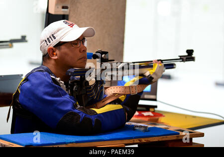 POINT, N.Y. (June 19, 2016) U.S. Navy veteran Hospital Corpsman 1st Class Luis Surla, an athlete with Team Navy, rests his chin on an air rifle prior to shooting a stationary and electronic target during a shooting competition at the U.S. Military Academy located in West Point, New York as part of the 2016 Department of Defense Warrior Games. The Warrior Games is an annual Paralympic-type event where wounded veterans from the Army, Marine Corps, Navy, Coast Guard, Air Force, Special Operations Command and the United Kingdom Armed Forces compete for medals in eight different sports. Stock Photo