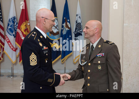 U.S. Army Command Sgt. Maj. Richard A. Woodring, Joint Force Headquarters – National Capital Region and U.S. Army Military District of Washington Senior Enlisted Leader, thanks Croatian Command Sgt. Maj. Davor Petek, Command Senior Enlisted Leader for Allied Command Operations at NATO’s Supreme Headquarters Allied Powers Europe, for visiting after a Wreath Laying Ceremony at the Tomb of the Unknown Soldier in Arlington National Cemetery, Arlington, Va.; July 16, 2018. Command Sgt. Maj. Petek placed a wreath at the tomb to pay tribute to U.S. Service Members for their contributions to NATO miss Stock Photo
