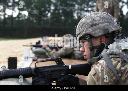 Spc. Nicholas Sobel from the U.S. Army Center for Initial Military Training zeros his weapon for the Range event for the TRADOC Best Warrior Competition, Fort Gordon, Georgia, July 17, 2018. The Best Warrior Competition recognizes TRADOC NCOs and Soldiers who demonstrate commitment to the Army Values, embody the Warrior Ethos, and represent the force of the future by testing them with physical fitness assessments, written exams, urban warfare simulations, and other warrior tasks and battle drills. (U.S. Army photo by Staff Sgt. Daniel Luksan) Stock Photo
