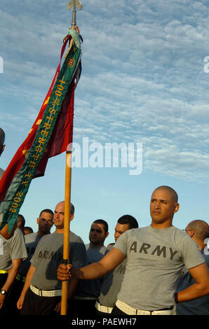 A Trooper attached to the 525th Military Police Battalion, stands-by with a guidon before a command run around Joint Task Force Guantanamo here, August 4, 2008. The 525th MP Battalion provides much of the guard force inside the JTF's detention facilities. JTF Guantanamo conducts safe and humane care and custody of detained enemy combatants. The JTF conducts interrogation operations to collect strategic intelligence in support of the Global War on Terror and supports law enforcement and war crimes investigations. JTF Guantanamo is committed to the safety and security of American service members Stock Photo