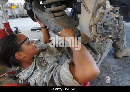 GUANTANAMO BAY, Cuba – Army Sgt. Sierra Bibbs, a generator equipment repair non-commissioned officer with the 525th Military Police Battalion assigned to Joint Task Force Guantanamo, installs brakes on a Humvee at the battalion motor pool, May 10, 2010. The 525th MP Battalion provides a portion of JTF Guantanamo’s guard force. JTF Guantanamo conducts safe, humane, legal and transparent care and custody of detainees, including those convicted by military commission and those ordered released by a court. The JTF conducts intelligence collection, analysis and dissemination for the protection of d Stock Photo