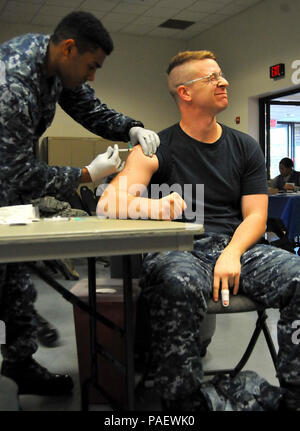Service members from the Navy Ceremonial Guard, as well as other active duty members, got their annual influenza vaccine during the annual ShotEx Oct. 5 at the Joint Base Anacostia-Bolling Main Chapel. The exercise helps provided all Tricare beneficiaries with the flu shot in an effort to prevent base residents from contracting and spreading the seasonal illness. Stock Photo