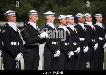 Sailors from the United States Navy Ceremonial Guard read the names of the 17 American Sailors Killed during the terrorist attack against the USS Cole during a ceremony in Arlington National Cemetery, Arlington, Va., Oct. 12, 2015. The attack took place Oct. 12, 2000. Stock Photo