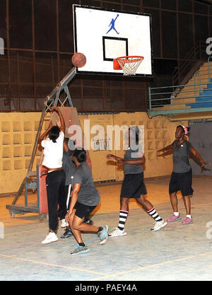 A Djiboutian player shoots during a game against the U.S. women's basketball team, made up of Combined Joint Task Force-Horn of Africa and Camp Lemonnier service members, at Djibouti University, Djibouti, July 16, 2013. The Djiboutians and Americans compete weekly to promote friendship, solidarity, and cultural exchange. CJFT-HOA Stock Photo