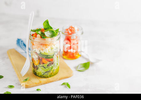 Tasty served salad wuth prawns in jar on table. Ready to eat. Detox Clean Eating Concept Stock Photo